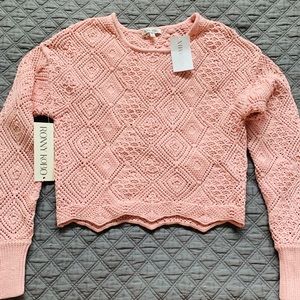 Ronny Kobo cropped pink crochet sweater.